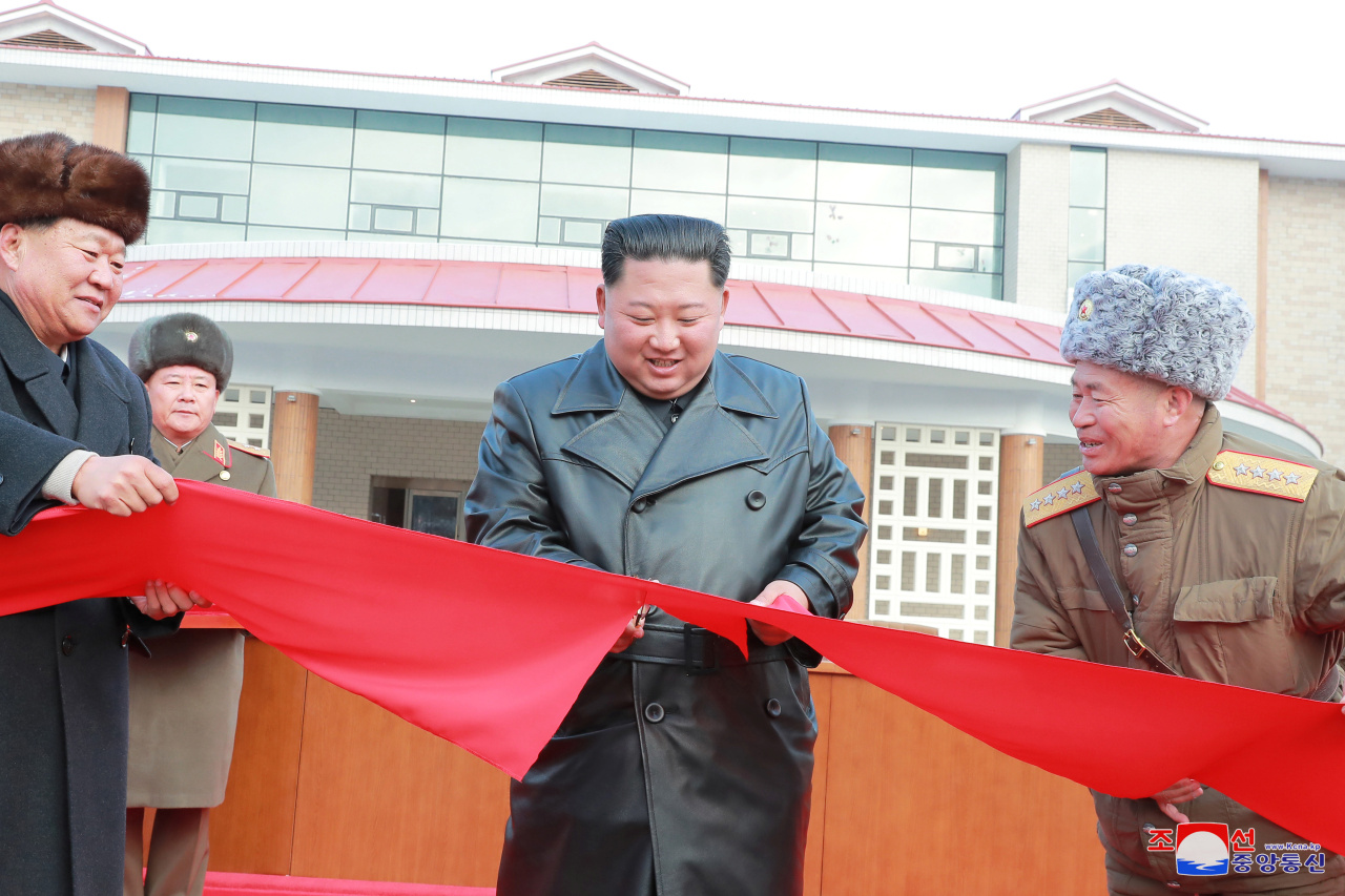 North Korean leader Kim Jong-un cuts a ribbon during a ceremony for the completion of the Yangdok County Hot Spring Cultural Recreation Center in North Korea in this undated picture released by North Korea's Central News Agency on Saturday. (KCNA)