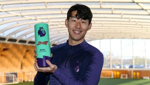 This image captured from the Premier League`s website on Jan. 11, 2020, shows Son Heung-min of Tottenham Hotspur posing with the trophy for the Goal of the Month for December. (Yonhap)