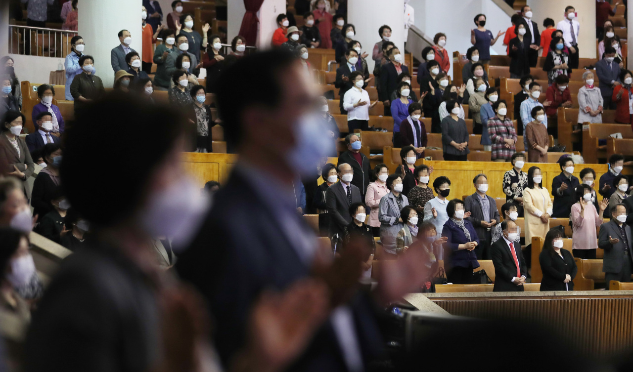Yoido Full Gospel Church members attend a Sunday service wearing masks. (Yonhap)