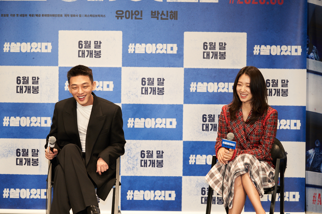Actors Yoo Ah-in (left) and Park Shin-hye attend a press conference for “#Alive” on Wednesday. (Lotte Entertainment)