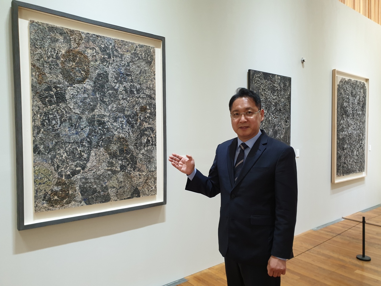 Ryu Chul-ha, director of Lee Ungno Museum, poses at the exhibition “Lee Ungno, Paintings made from Paper” at the museum in Daejeon, on June 2. (Park Yuna/The Korea Herald)