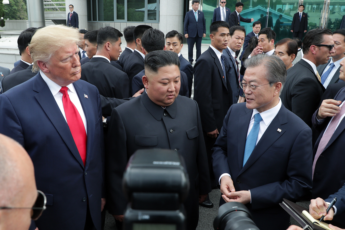 South Korean President Moon Jae-in, North Korean leader Kim Jong-un and US President Donald Trump meet at Panmunjom on June 30, 2019. In his memoir, former US national security advisor John Bolton claimed that Moon was an unwelcome guest at the meeting. (Cheong Wa Dae)