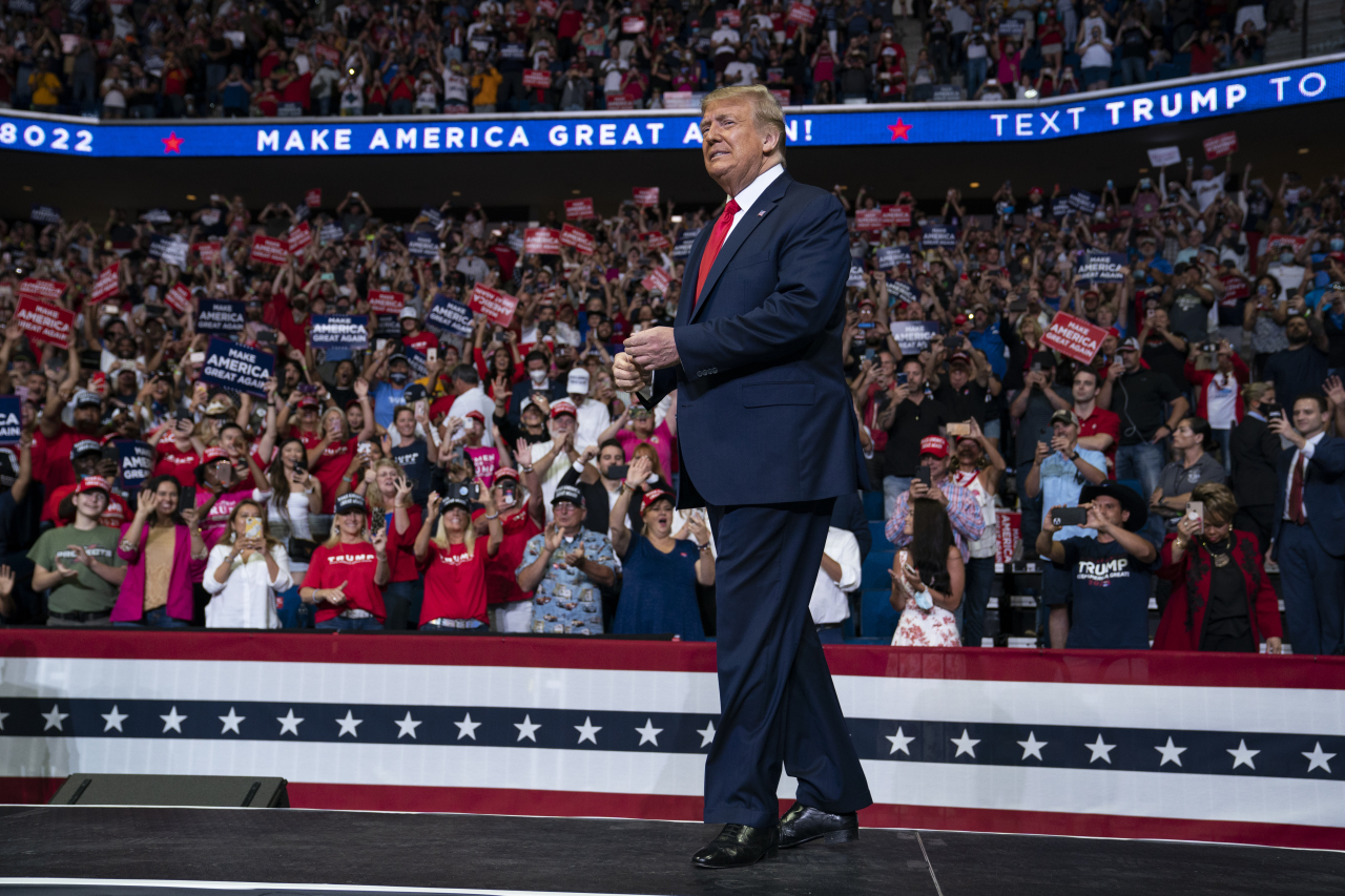 In this June 20, 2020, file photo US President Donald Trump arrives on stage to speak at a campaign rally at the BOK Center in Tulsa, Okla. (AP-Yonhap)