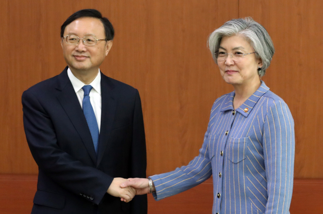 File photo showing South Korea`s Minister of Foreign Affairs Kang Kyung-wha (right) with China`s Yang Jiechi. (Yonhap)