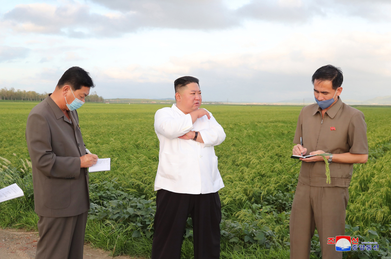 North Korean leader Kim Jong-un visits a typhoon-hit area in North Korea`s southwestern province of South Hwanghae last week. (KCNA-Yonhap)