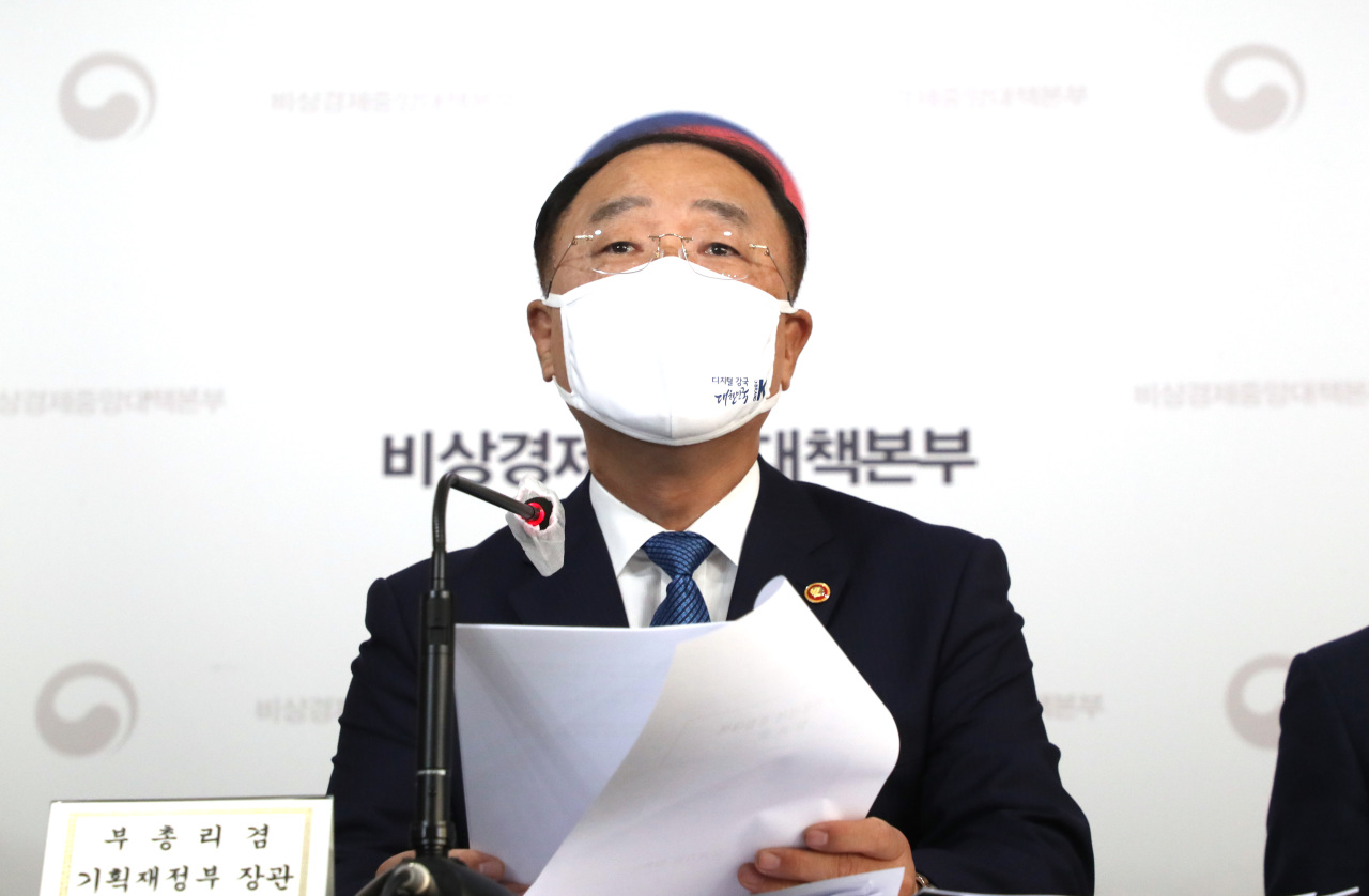 Finance Minister Hong Nam-ki attends a press briefing at the Seoul government complex on Thursday (Yonhap)