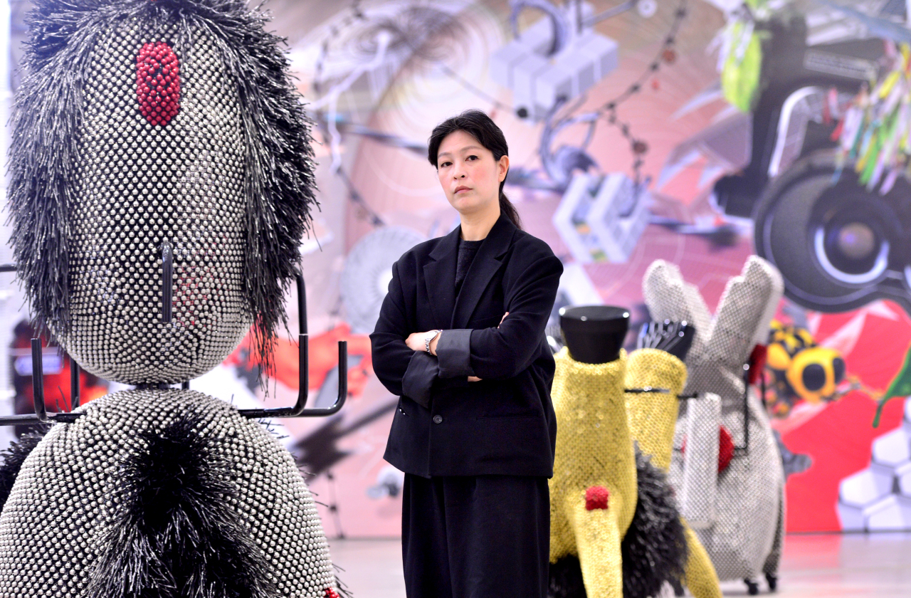Yang Hae-gue poses next to her latest “Sonic Domesticus” series at MMCA Seoul (Park Hyun-koo/The Korea Herald)