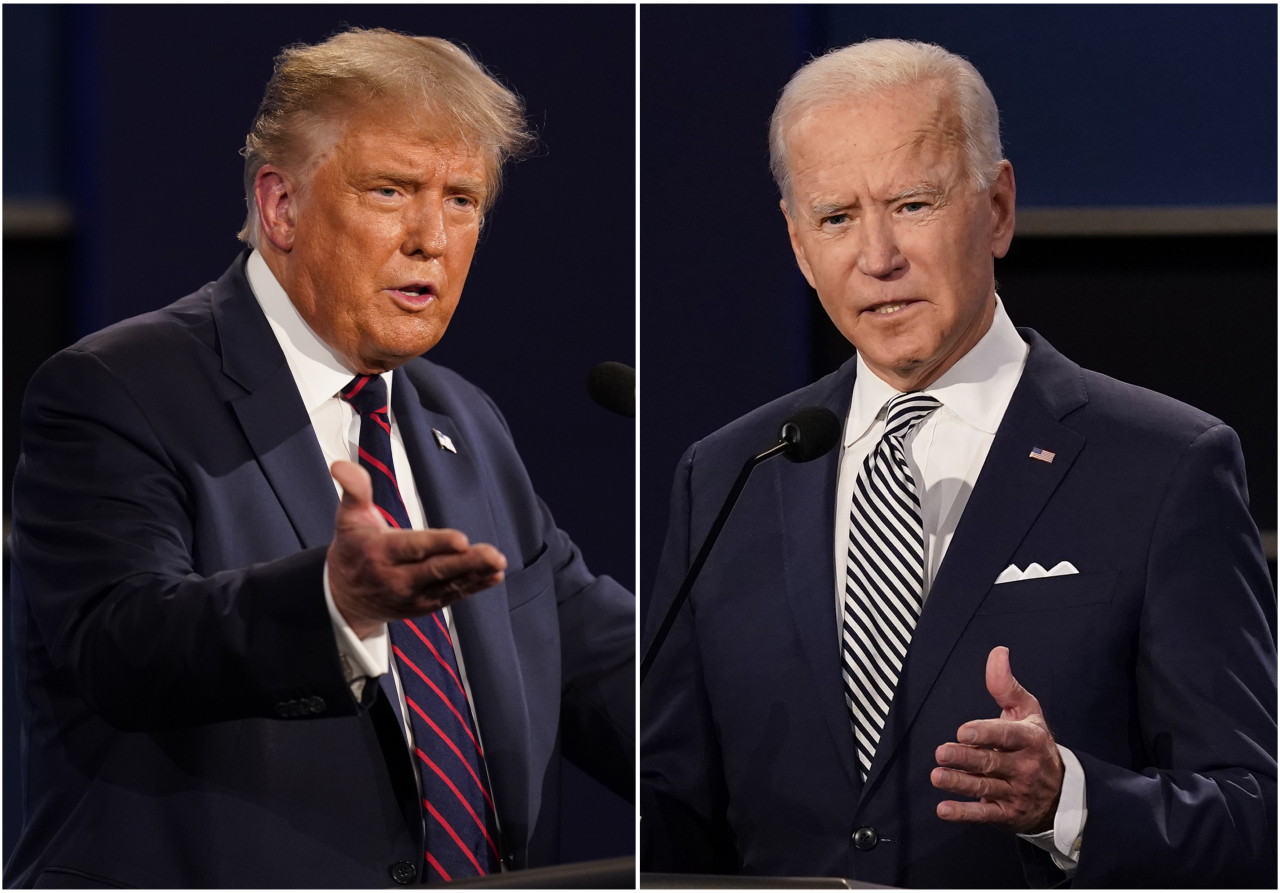 This combination of Sept. 29, 2020, file photos shows President Donald Trump, left, and former Vice President Joe Biden during the first presidential debate at Case Western University and Cleveland Clinic, in Cleveland, Ohio. (AP-Yonhap)