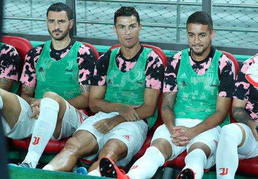 This photo from July 26, 2019, shows Cristiano Ronaldo (C) sitting on the bench during the exhibition match held between a K League All-Star team and Juventus FC at Seoul World Cup Stadium. (Yonhap)