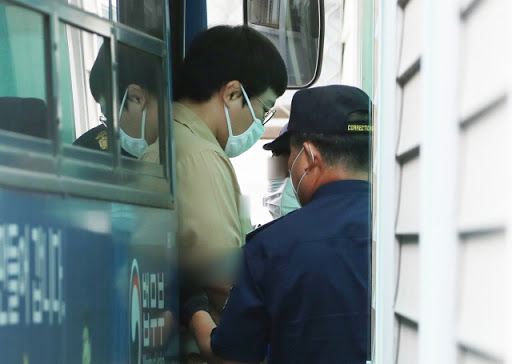 The undated file photo shows Wang Ki-chun heading to attend a court trial. (Yonhap)