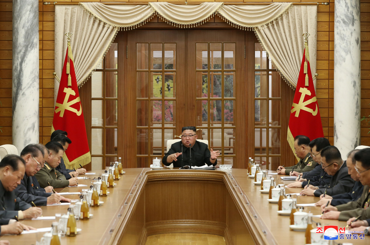 North Korean leader Kim Jong-un (C) presides over a politburo meeting of the Workers' Party and discusses preparation for an upcoming rare party meeting on Monday. (KCNA-Yonhap)