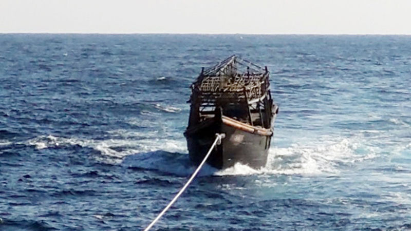 This file photo, provided by the unification ministry, shows a North Korean fishing boat being towed by a South Korean ship. The boat was returned to the North on Nov. 8, 2019, a day after Seoul deported two North Koreans accused of killing 16 fellow crew members. (Ministry of Unification)