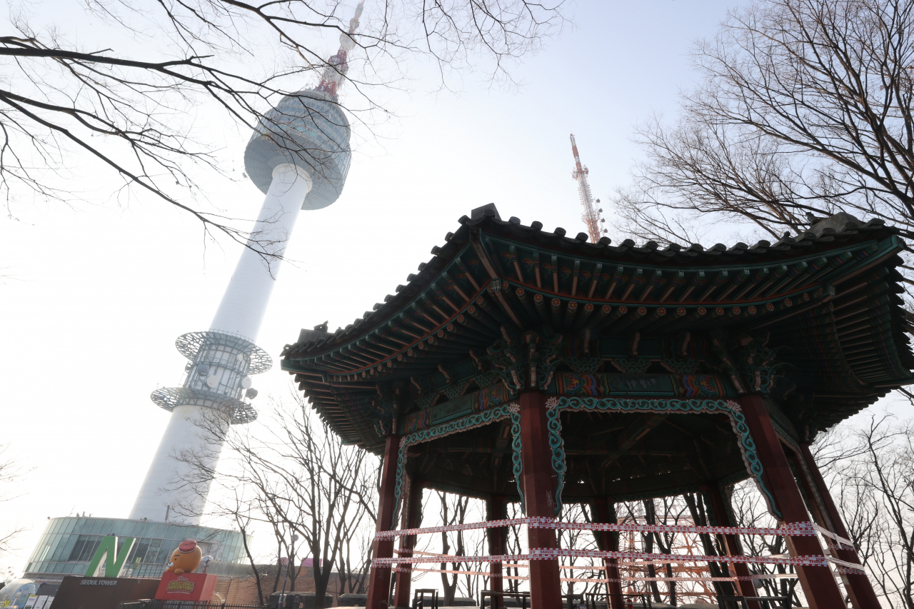 Namsan Seoul Tower and a traditional Korean pavilion in Seoul are seen in this photo taken Tuesday. The tourist sites will be closed from Dec. 24 to Jan. 3, 2021, under special preventive measures against COVID-19. (Yonhap)