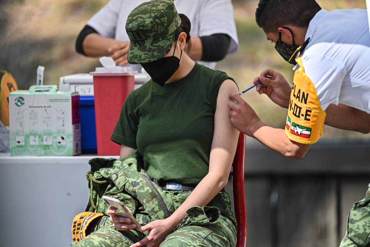 A Mexican military medic receives the Pfizer/BioNTech COVID-19 vaccine jab, at the Military College in Mexico City on Dec. 27, 2020. (AFP)