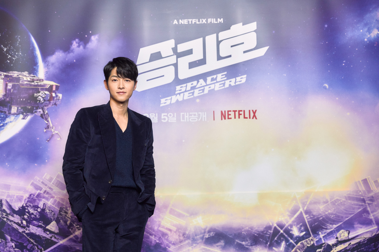 Song Joong-ki poses before the “Space Sweeper” online press conference on Tuesday. (Netflix)