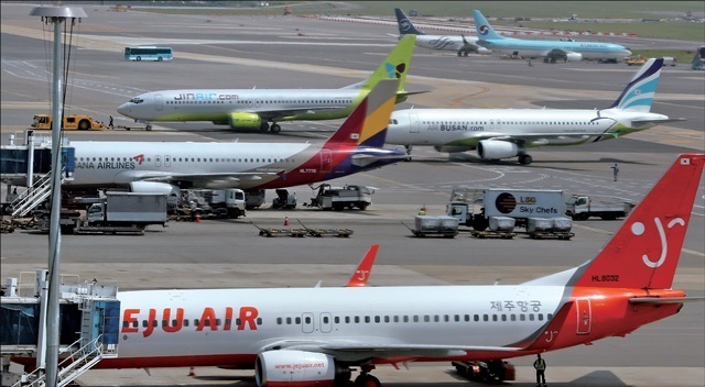 Planes from low-cost carriers are on the ground at Gimpo Airport in Seoul. (Yonhap)