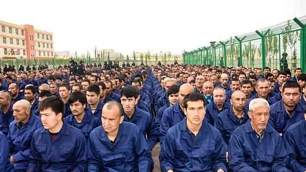 Uighur Muslims at a factory in China. (BBC)