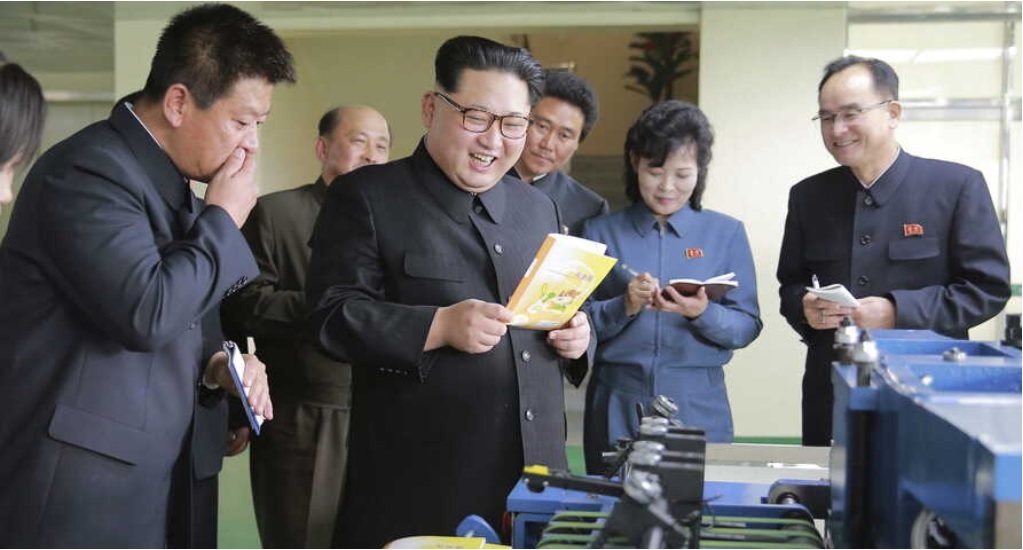 North Korean leader Kim Jong-un, accompanied by Jo Yong-won (far right), makes an on-site visit to a machinery factory in Pyongyang in this 2016 file photo. (KCNA-Yonhap)
