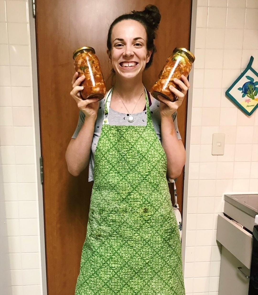 Jennifer Corpus, an American, holds jars of homemade kimchi (Jennifer Corpus)