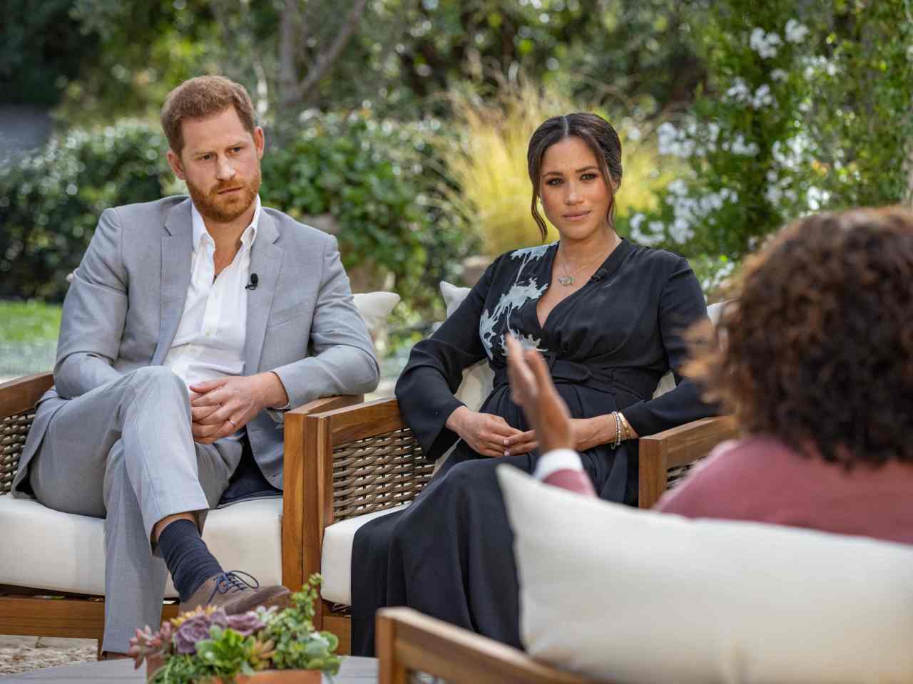 This undated image released Sunday courtesy of Harpo Productions shows Britain's Prince Harry (L) and his wife Meghan (C), Duchess of Sussex, in a conversation with US television host Oprah Winfrey. (AFP-Yonhap)