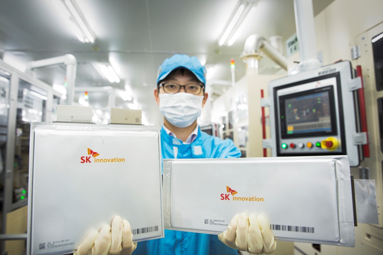 An SK Innovation official holds up pouch-type cells. (SK Innovation)