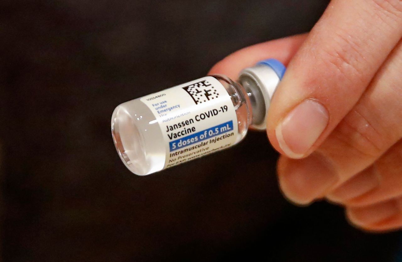 In this file photo registered nurse Florisa N. Lingad holds a Johnson & Johnson Covid-19 vaccine at a vaccination center established at the Hilton Chicago O'Hare Airport Hotel in Chicago, Illinois, on March 5, 2021. (AFP)