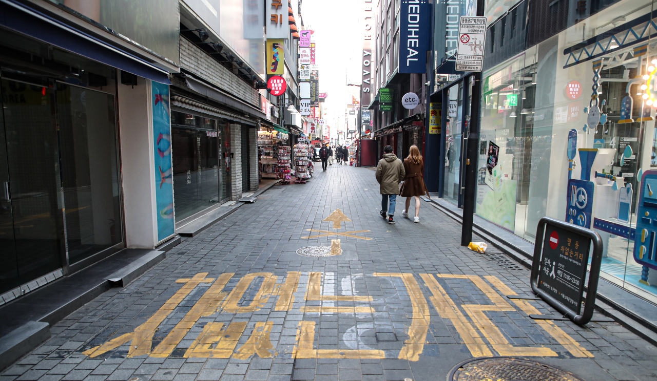 This file photo, taken Feb. 13, 2021, shows an almost empty street of Seoul's shopping district of Myeongdong amid the pandemic. (Yonhap)