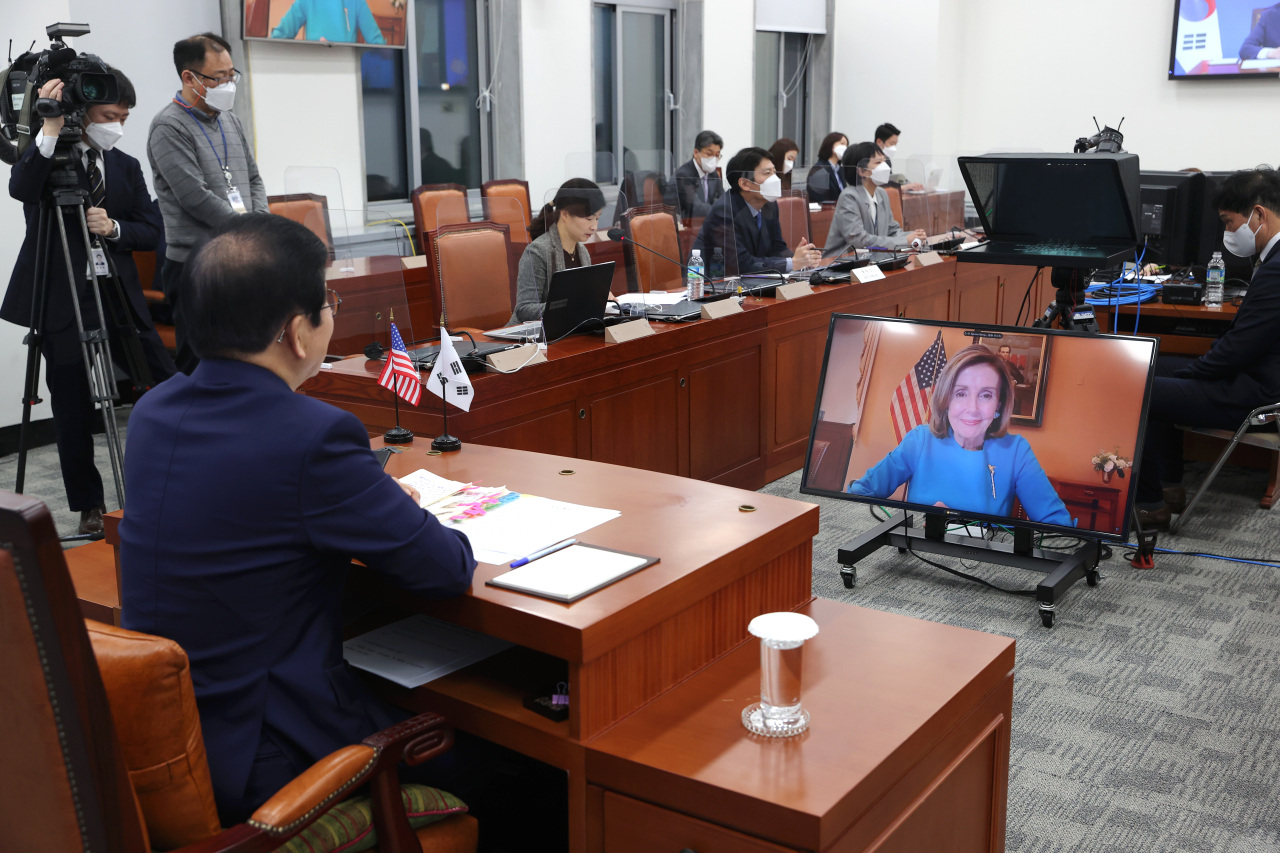 National Assembly Speaker Park Byeong-seug holds a videoconference with US House Speaker Nancy Pelosi on Friday. (National Assembly)