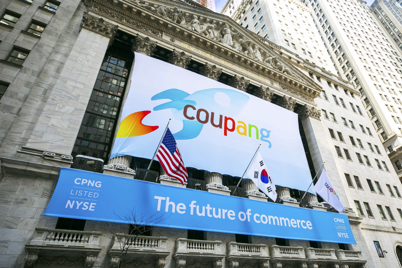 In this photo provided by the New York Stock Exchange, a banner for South Korea's Coupang adorns the New York Stock Exchange facade before his company's IPO March 11 (AP-Yonhap)