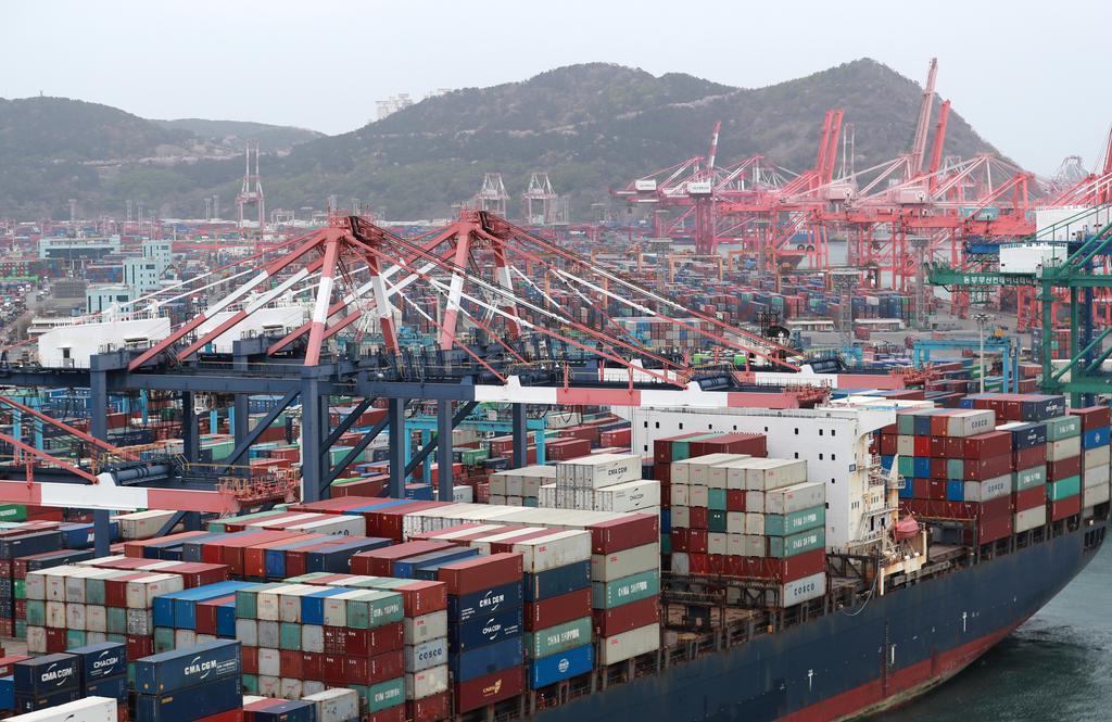 Cargo containers are stacked at a port in Busan, 453 kilometers southeast of Seoul, on April 1, 2021, in this file photo. (Yonhap)