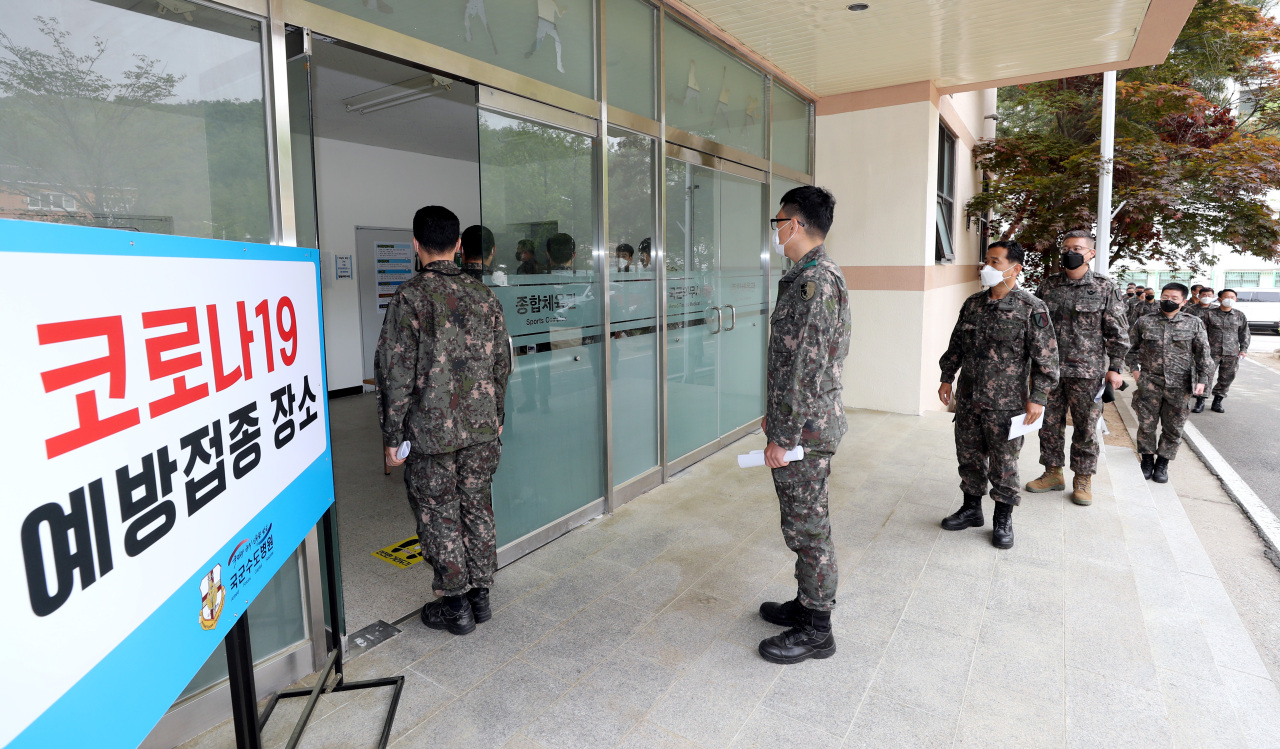 Soldiers wait in line to be vaccinated at the Armed Forces Capital Hospital in Seongnam, south of Seoul, on Wednesday, in this photo provided by the Kookbang Ilbo. (Kookbang Ilbo)