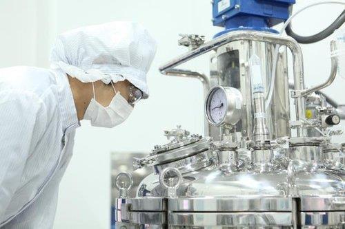 This undated photo, provided by South Korean biotech company GC Pharma, shows a company official at its plant. (Yonhap)