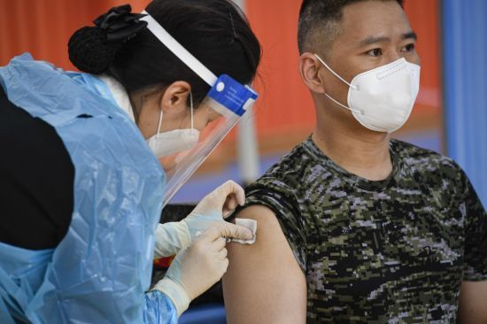 A member of the Marine Corps headquarters receives a COVID-19 vaccine on April 28, 2021, in this photo provided by the military. (Military)