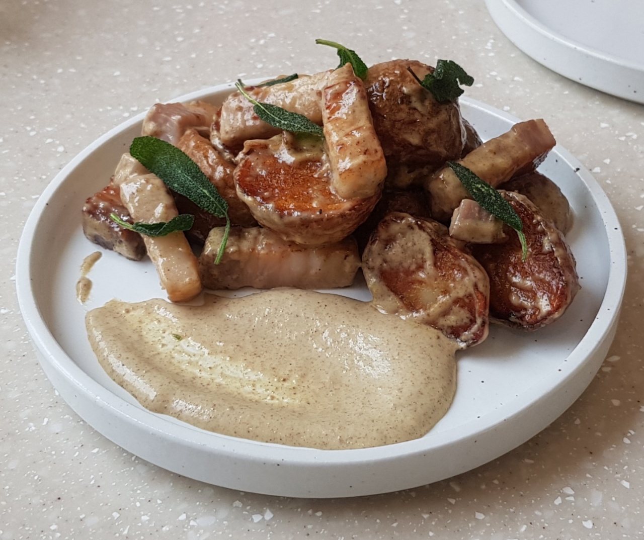 tro Anthro's fried baby potatoes are peppered with house-made bacon, fired sage and an aioli-based sauce. (Jean Oh / The Korean Herald)