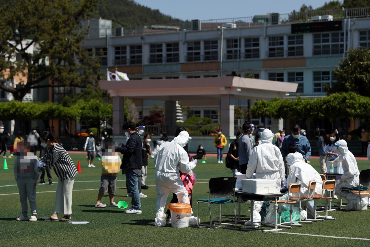 Students get tested for COVID-19 at an elementary school in South Jeolla Province on May 3. (Yonhap)