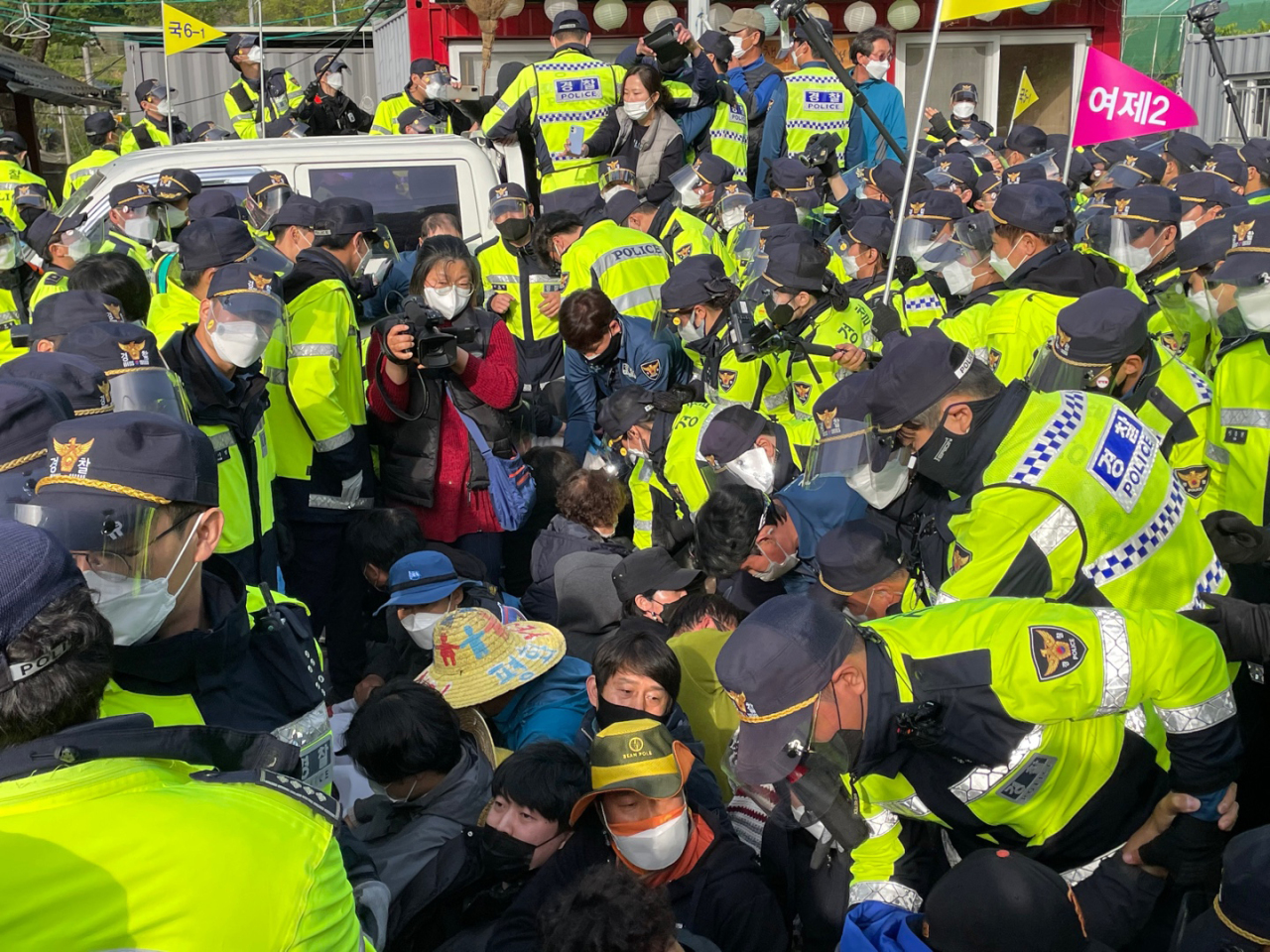 In the April 28, 2021, file photo, police break up a sit-in by residents and activists opposing the delivery of electrical equipment and construction materials into the US Terminal High Altitude Area Defense (THAAD) base in the southeastern county of Seongju, North Gyeongsang Province. (Yonhap)