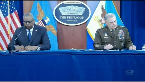 The image captured from the website of the US Department of Defense shows Secretary of Defense Lloyd Austin (L) and Gen. Mark Milley, chairman of the Joint Chiefs of Staff, testifying at a hearing before the House Appropriation Subcommittee on Defense in Washington on Thursday. (Yonhap)