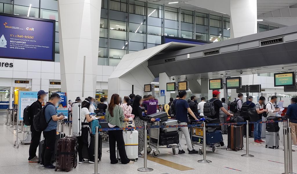 In this photo provided by the South Korean Embassy in New Delhi, South Korean residents in India go through the departure procedure at Indira Gandhi International Airport in India's capital city on May 17, 2021, to return home on a chartered plane from the COVID-19-ravaged country. (South Korean Embassy in New Delhi)