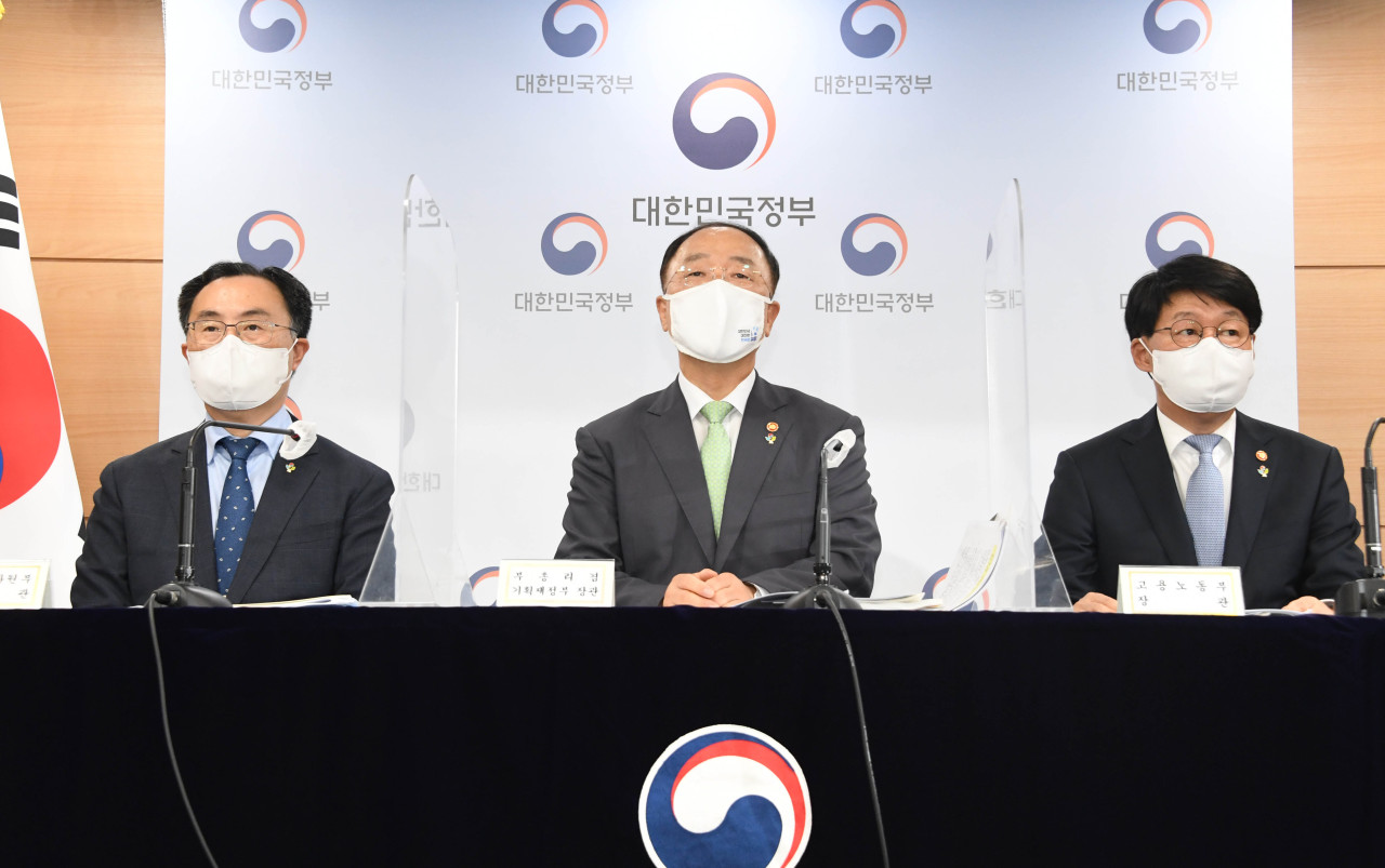 Finance Minister Hong Nam-ki (center) speaks during a press conference on the direction of economic policy for the second half of 2021, held at the government complex in Seoul, Monday. (Ministry of Economy and Finance)