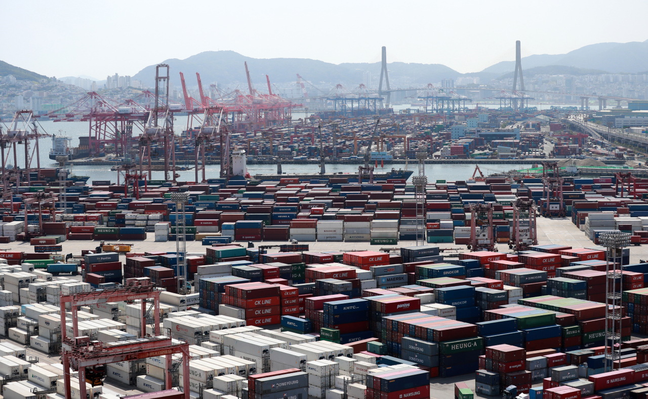 This file photo, taken June 1, 2021, shows ships carrying containers docking at a port in the southeastern city of Busan. (Yonhap