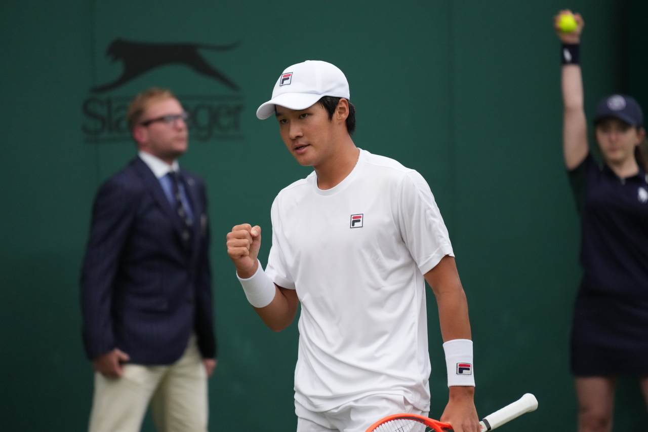 In this Associated Press photo, Kwon Soon-woo of South Korea celebrates a point against Dominik Koepfer of Germany during their second round men's singles match at Wimbledon at All England Club in London on Wednesday. (Yonhap)