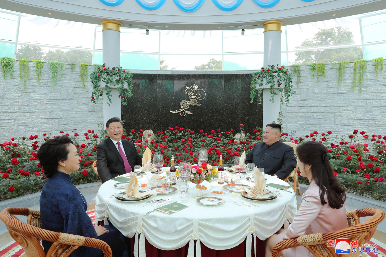 Chinese President Xi Jinping (2nd from L) and North Korean leader Kim Jong-un (2nd from R) have a luncheon with their respective wives -- Peng Liyuan (L) and Ri Sol-ju -- at the Kumsusan State Guesthouse in Pyongyang on June 21, 2019, in this photo released by the North's official Korean Central News Agency. (KCNA)