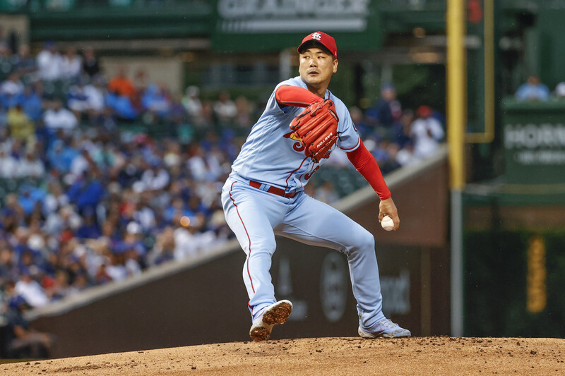 In this USA Today Sports photo via Reuters, Kim Kwang-hyun of the St. Louis Cardinals pitches against the Chicago Cubs in the bottom of the first inning of a Major League Baseball regular season game at Wrigley Field in Chicago on Saturday. (USA Today)