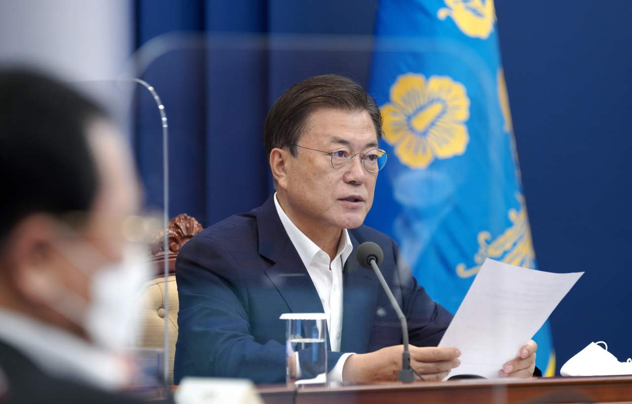 President Moon Jae-in speaks during an emergency meeting on COVID-19 at Cheong Wa Dae on Monday, in this photo provided by his office. (Cheong Wa Dae)