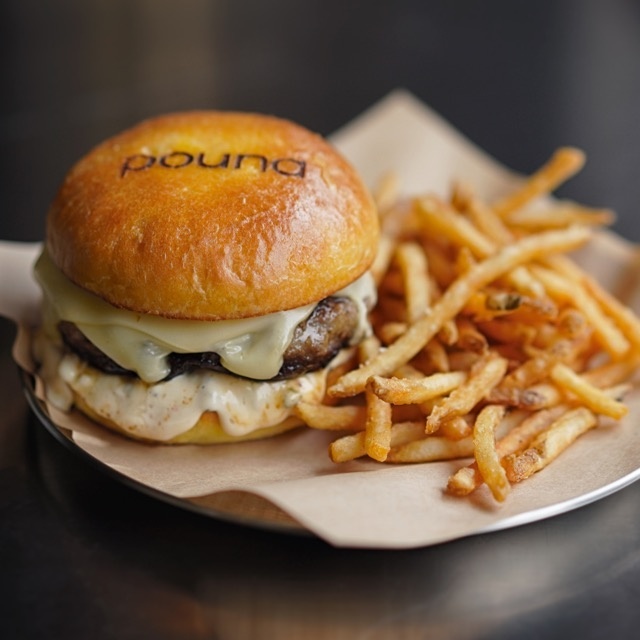 Pound’s signature burger packs a flavorful punch with five components -- a brioche bun, beef patty, Swiss cheese, pickled onions and their “Pound” sauce. (poundseoul)