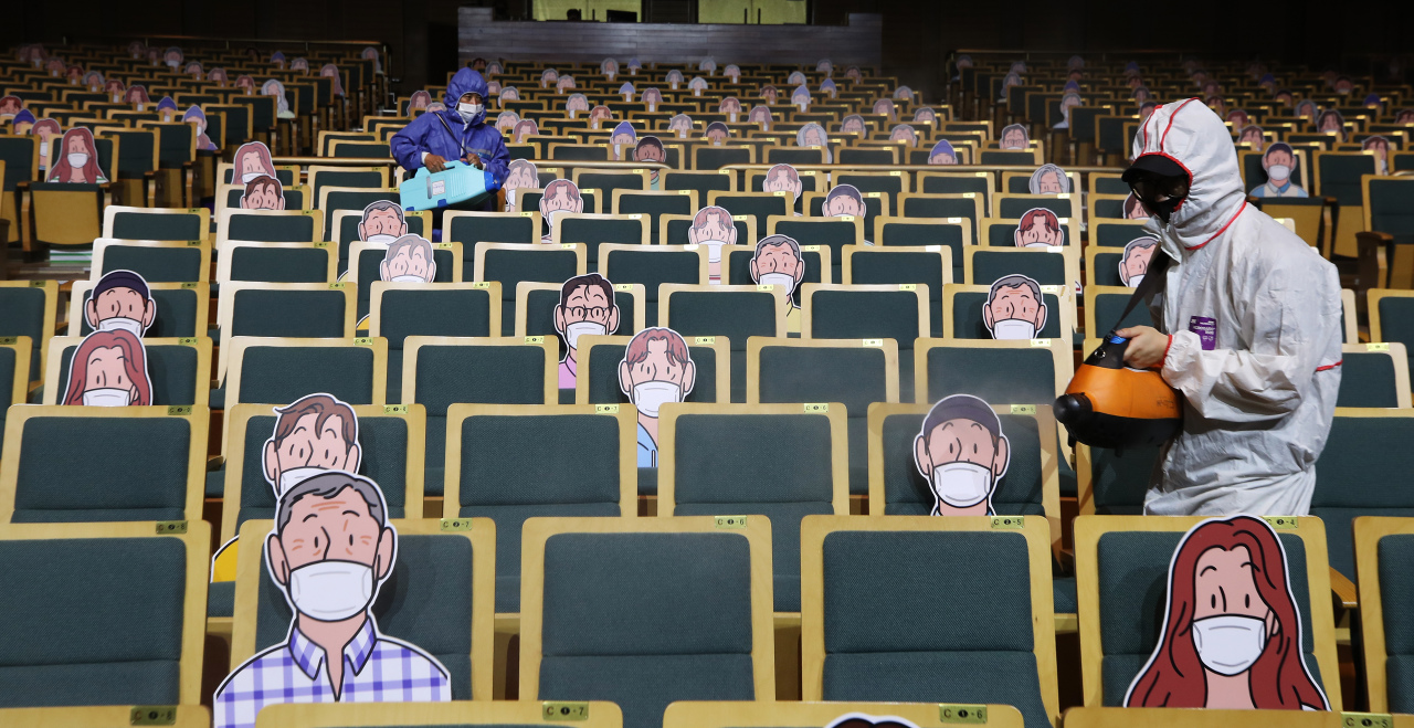 A health care worker disinfects a theater at the Gyeonggi Arts Center in Suwon, south of Seoul, on Wednesday. (Yonhap)