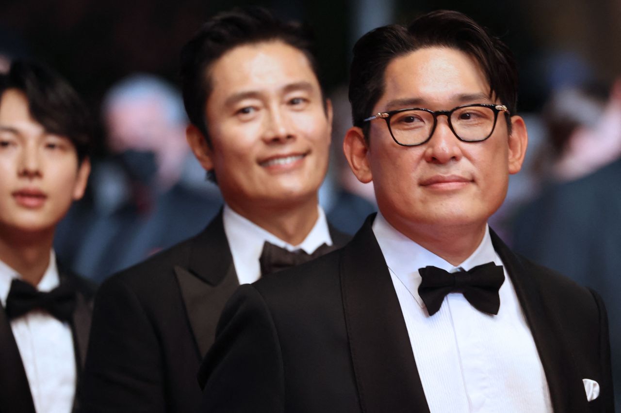 Director Han Jae-rim arrives with actors Yim Si-wan (Left) and Lee Byung-hun (Center) for the screening of the film 