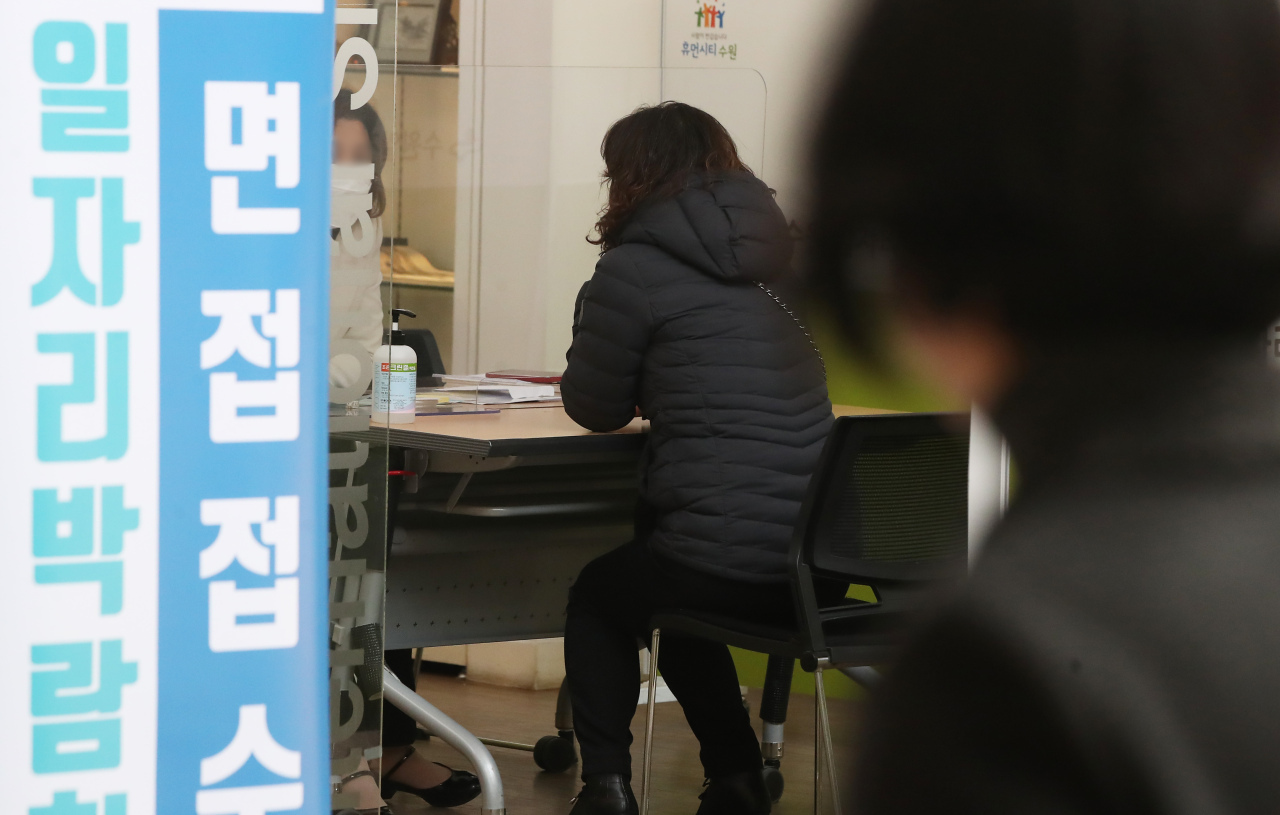 A woman is interviewed during a job fair in Suwon City Hall in Gyeonggi Province earlier this year. (Yonhap)