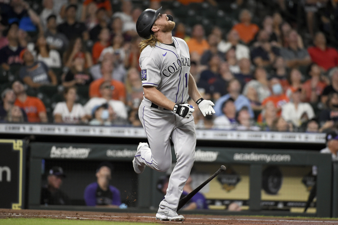 In this Associated Press photo, Taylor Motter of the Colorado Rockies hits a pop fly during the top of the second inning a Major League Baseball regular season game against the Houston Astros at Minute Maid Park in Houston on Aug. 10, 2021. (Yonhap)