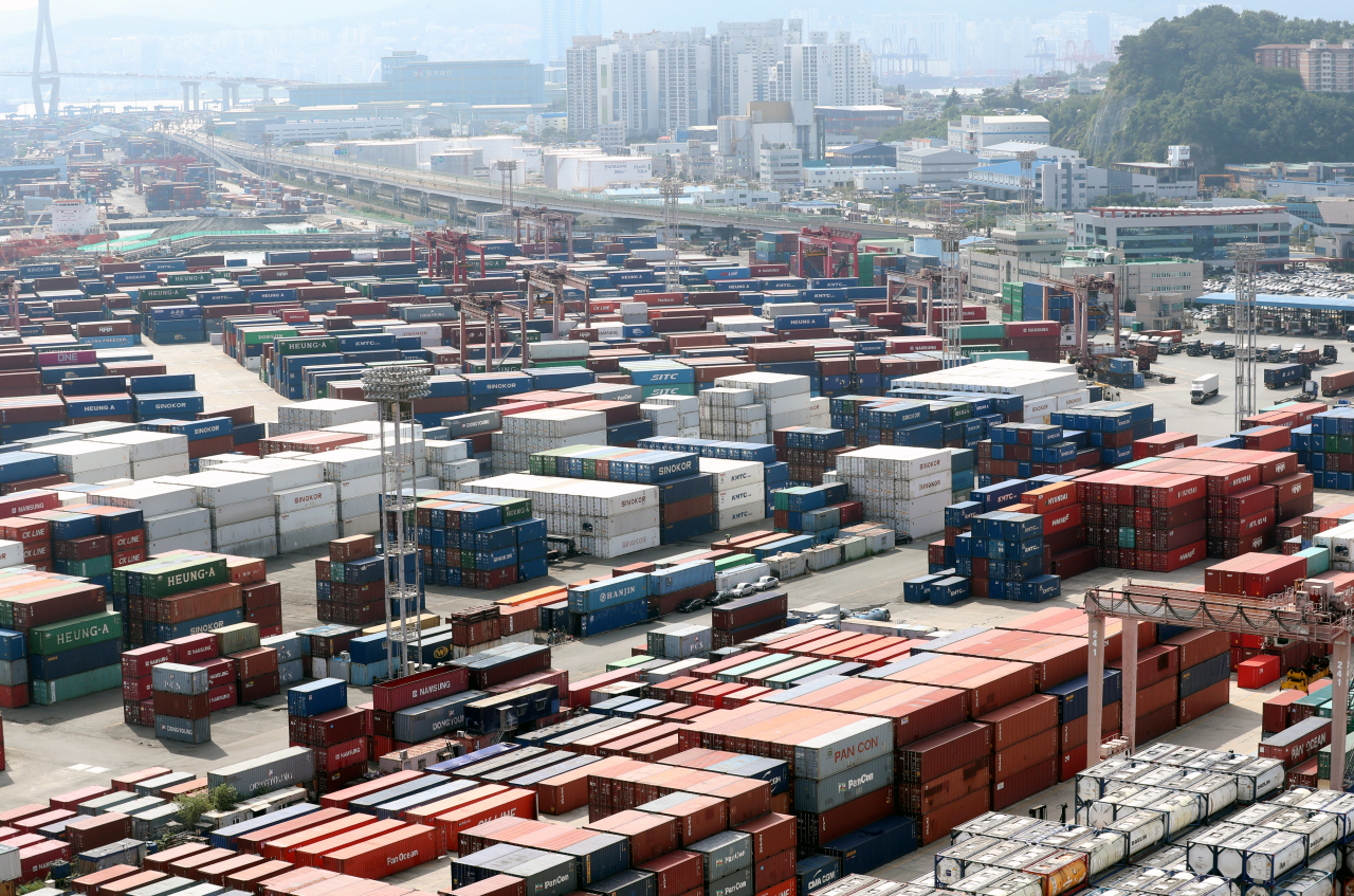 his file photo, taken Aug. 2, 2021, shows stacks of containers at a port in South Korea's southeastern city of Busan. (Yonhap)